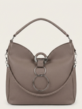 A taupe leather shoulder bag with a distinctive curved top, a braided strap detail, and a large silver-tone triple-ring hardware closure on the front, set against a solid off-white background.