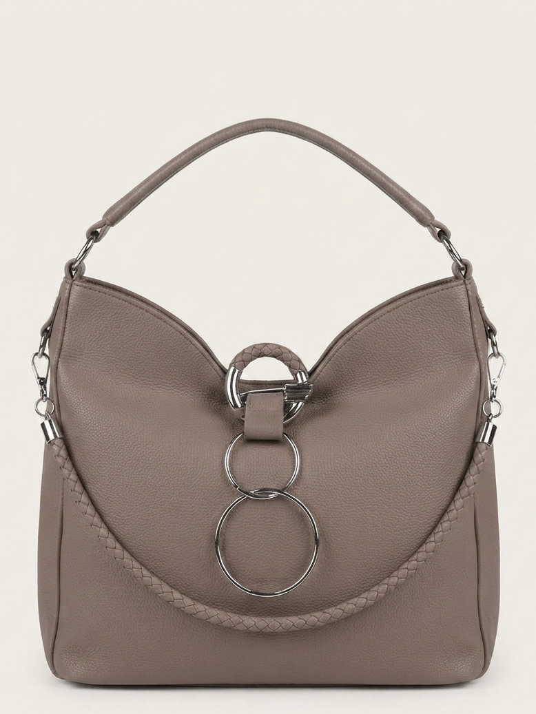 A taupe leather shoulder bag with a distinctive curved top, a braided strap detail, and a large silver-tone triple-ring hardware closure on the front, set against a solid off-white background.